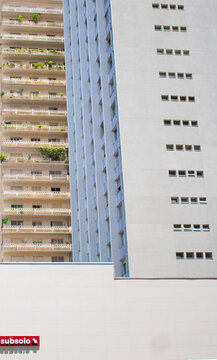 Two Buildings and a Sign with "undergorund level" written on it (Subsolo) 