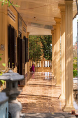 The beautiful morning at the Golden Buddha holding a lotus flower at Chon Khong Monastery attracts tourists to visit on weekends in Vung Tau. Travel concept