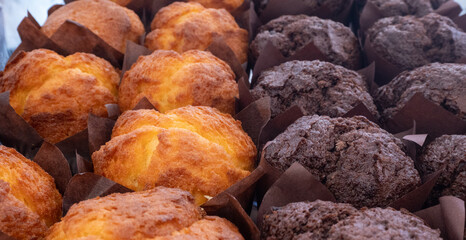 vanilla and chocolate muffins in the store