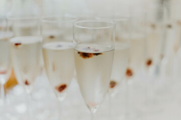 glasses of champagne with fruit