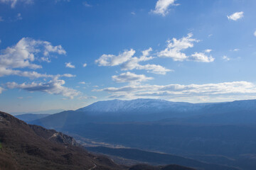 Fototapeta na wymiar View of the high snow-capped mountains of Montenegro.