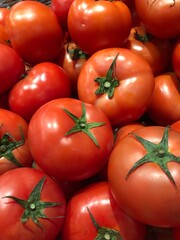 delicious  ripe red tomatoes at the farmer's market.