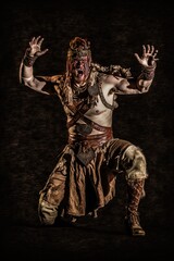 Fototapeta na wymiar Fierce warrior with warpaint.