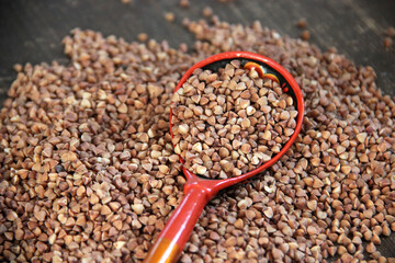 Peeled groats of buckwheat  on the background wood