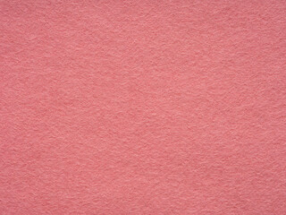 Fototapeta premium Soft rose, pink felt material blank. Surface of felted fabric texture abstract background. Pattern for text, lettering, patchworkor 3d art work. Full frame backdrop wallpaper. Retro, vintage pattern.