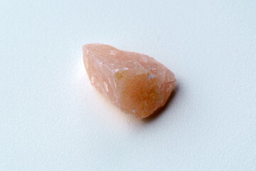 Natural mineral crystal of rose quartz gemstone. Natural rose quartz crystal. White background