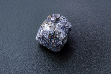 Naklejka premium Natural mineral stone cordierite gemstone, geological collection raw crystal