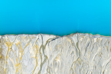 Drone view of the azure lake in the glacier valley. View of the moraines. Landscape from the air. ...