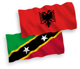 Flags of Federation of Saint Christopher and Nevis and Albania on a white background