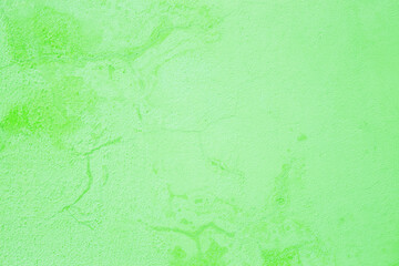 Green abstract background..Beautiful green textured stucco on the wall..Background from green stucco.
