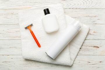 shaving man set. shaving machine, towel, lotion and shaving foam on colored background. Men bath Accessories top view