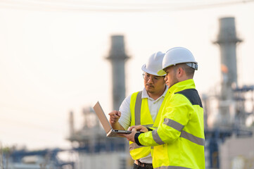 Group Asian man petrochemical engineer working at oil and gas refinery plant industry factory,The...