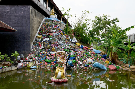 CHANTHABURI, THAILAND - February 20, 2023 : Statue of Thokkathan-Mother Earth Squeezing Her Hair (Phra Mae Thorani) located in the middle of the pond for Thai Buddhists to pay homage and pray.