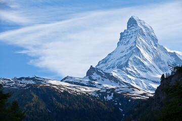 Matterhorn at day time.  The Matterhorn is a mountain of the Alps, straddling the main watershed and border between Switzerland and Italy.