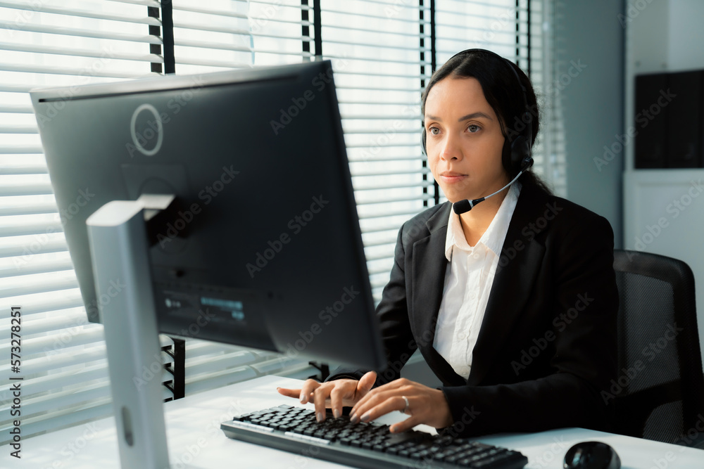 Aufkleber competent female operator working on computer and talking with clients. concept relevant to both cal