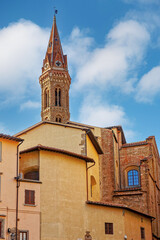 Fototapeta na wymiar Bell tower of the Badia Fiorentina church in Florence, Italy