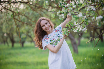 girl in the spring garden in bloom in spring 