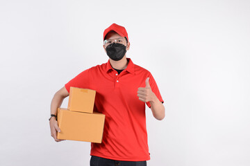 Fototapeta na wymiar Delivery man employee in red cap blank t-shirt uniform