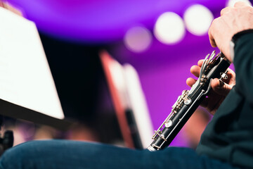 A musician playing the clarinet during an orchestra rehearsal