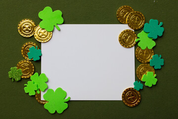 Happy St Patricks Day. White list with shamrocks decor on a green background