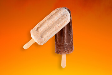 Peanut and chocolate popsicle with orange gradient background - obrazy, fototapety, plakaty