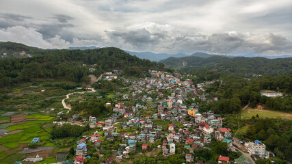 Fototapeta na wymiar Town of Sagada in the valley among the mountains covered with forest. Philippines.