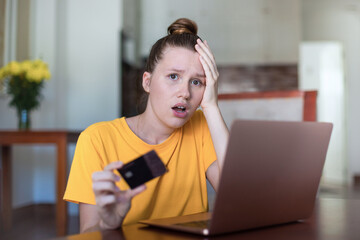 Internet fraud. Nervous sad upset unhappy confused young woman, stressed worried lady having...