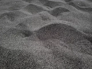 Fotobehang black beach sand dunes texture © benjamin