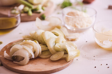 Slices of Fennel on a board. Ingredients for preparing Grated Fennel