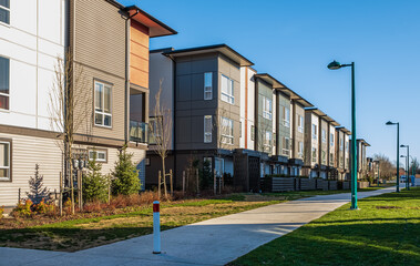 Naklejka premium New residential townhouses. Modern apartment buildings in BC Canada. Modern complex of apartment buildings