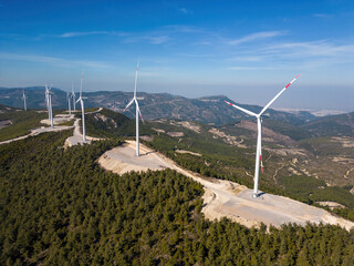 Windmills (wind turbines) on top of a mountain.