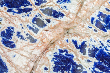 Sodalite mineral stone with its royal blue structure and characteristic fibrous white streaks