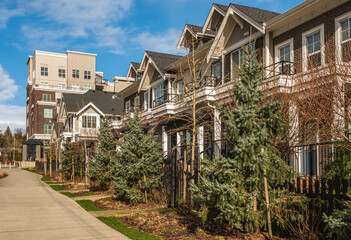 Modern residential houses neighborhood street in a suburban residential area. New and comfortable...