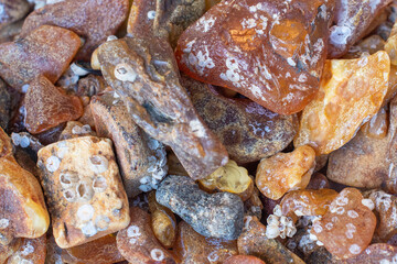 Raw unpolished amber stones. Baltic amber resin. Natural gem with healing properties