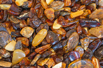 A lot of different shaped and polished Baltic amber stones