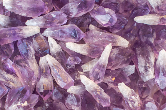 A stack of amethyst crystals with vitreous luster and prismatic tips. A transparent variety of quartz. The magic stone used as a talisman