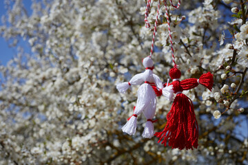 Bulgarian traditional spring decor martenitsa on the blossom tree. Baba Marta holiday. - obrazy, fototapety, plakaty