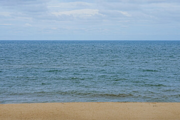 Sand beach with Summer Sky. Panoramic Seaside with Ocean wave landscape. Tropical beach and seascape with Blue Sky and soft sand, with calmness, tranquil relaxing day in South of Thailand
