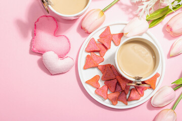 Obraz na płótnie Canvas Valentine's Day romantic concept. Morning coffee, a bouquet of tulips, symbolic decor
