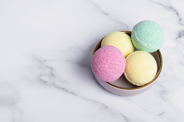 Colorful bath bombs on ate. Home spa. Space for text