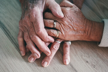 Old people holding hands close up view, senior retired family couple express care as psychological support concept, trust in happy marriage, empathy hope
