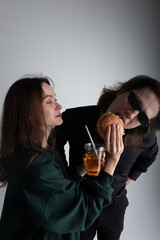 boy and girl eating burger