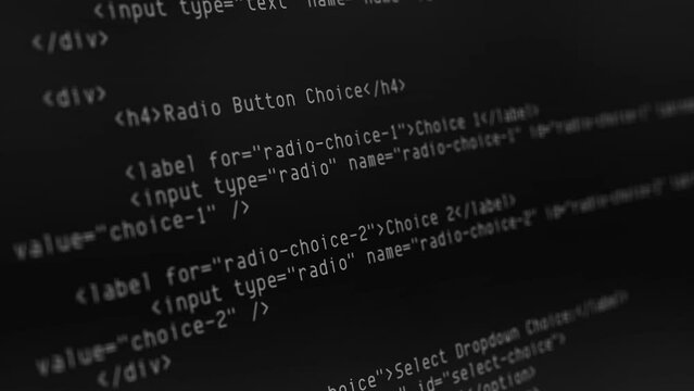closeup black computer screen scrolling programming code