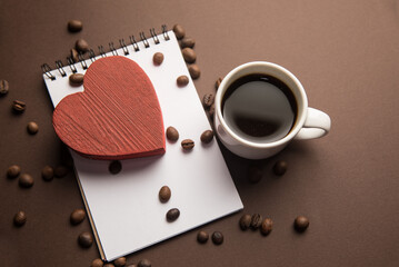 Notepad, red heart and coffee cup