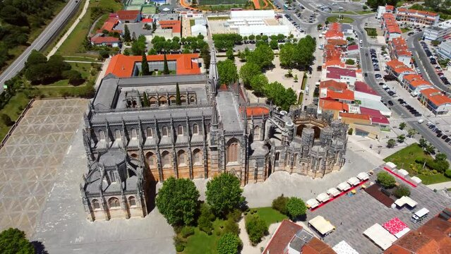 Aerial footage of historic UNESCO heritage site and landmark of famous Batalha monastery in Portugal
