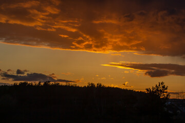 Natural sunset Sunrise over a field or meadow.