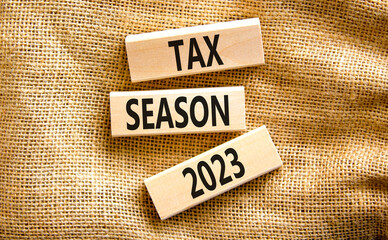 Tax season 2023 symbol. Concept words Tax season 2023 on wooden blocks on a beautiful canvas table canvas background. Business Tax season 2023 concept. Copy space.