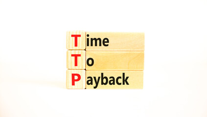 TTP time to payback symbol. Concept words TTP time to payback on wooden blocks on a beautiful white table white background. Business TTP time to payback concept. Copy space.