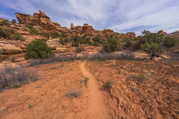 hiking the chesler park loop trail in the needles in canyonlands national park, usa