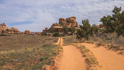 hiking the chesler park loop trail in the needles in canyonlands national park, usa